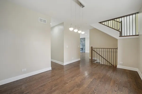 a view of entryway with wooden floor