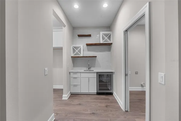 a bathroom with a sink and vanity