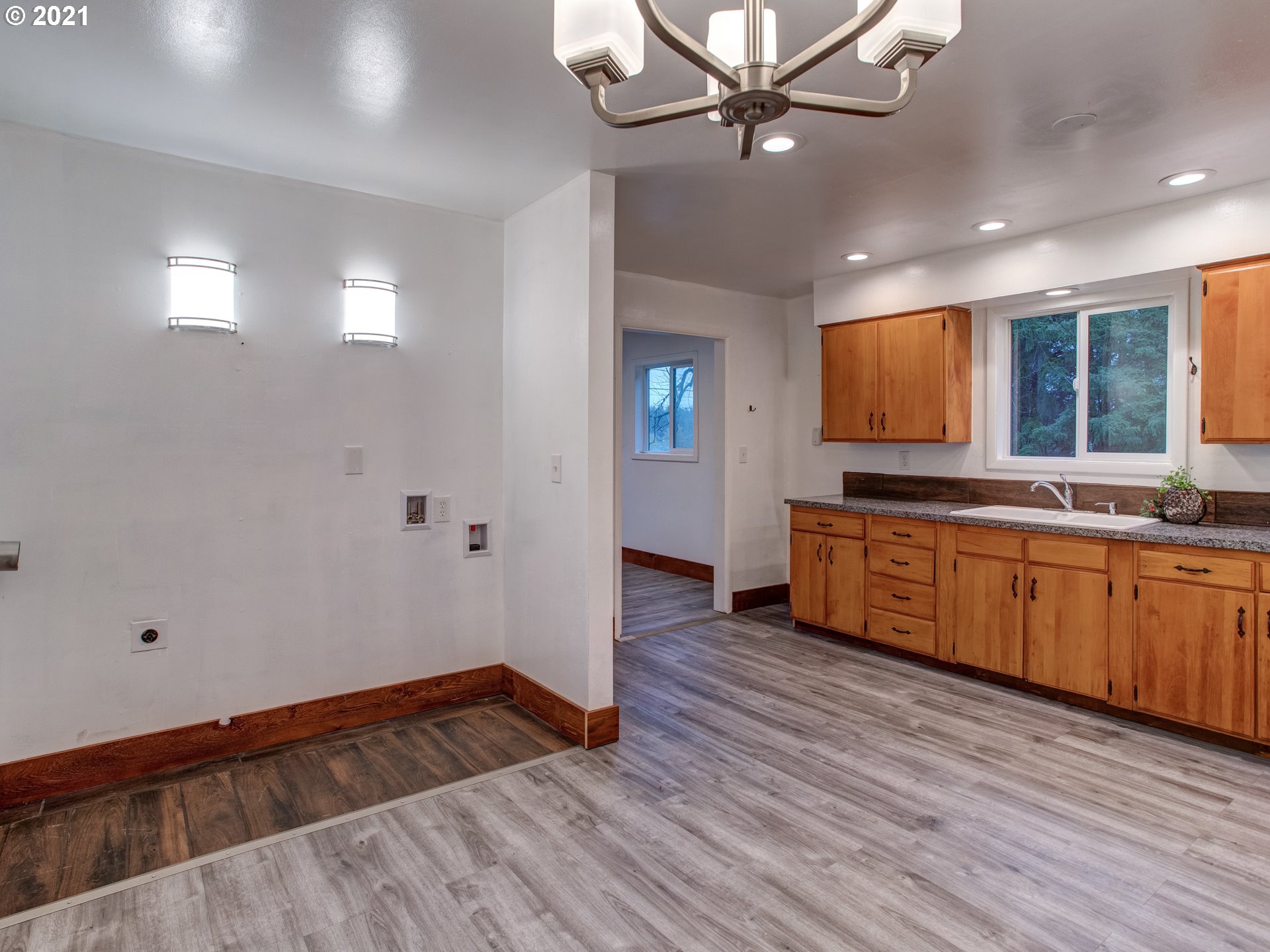 2517 Northeast 199th Street Ridgefield, WA 98642 - Photo 12 of 25 a view of an empty room with window and wooden floor