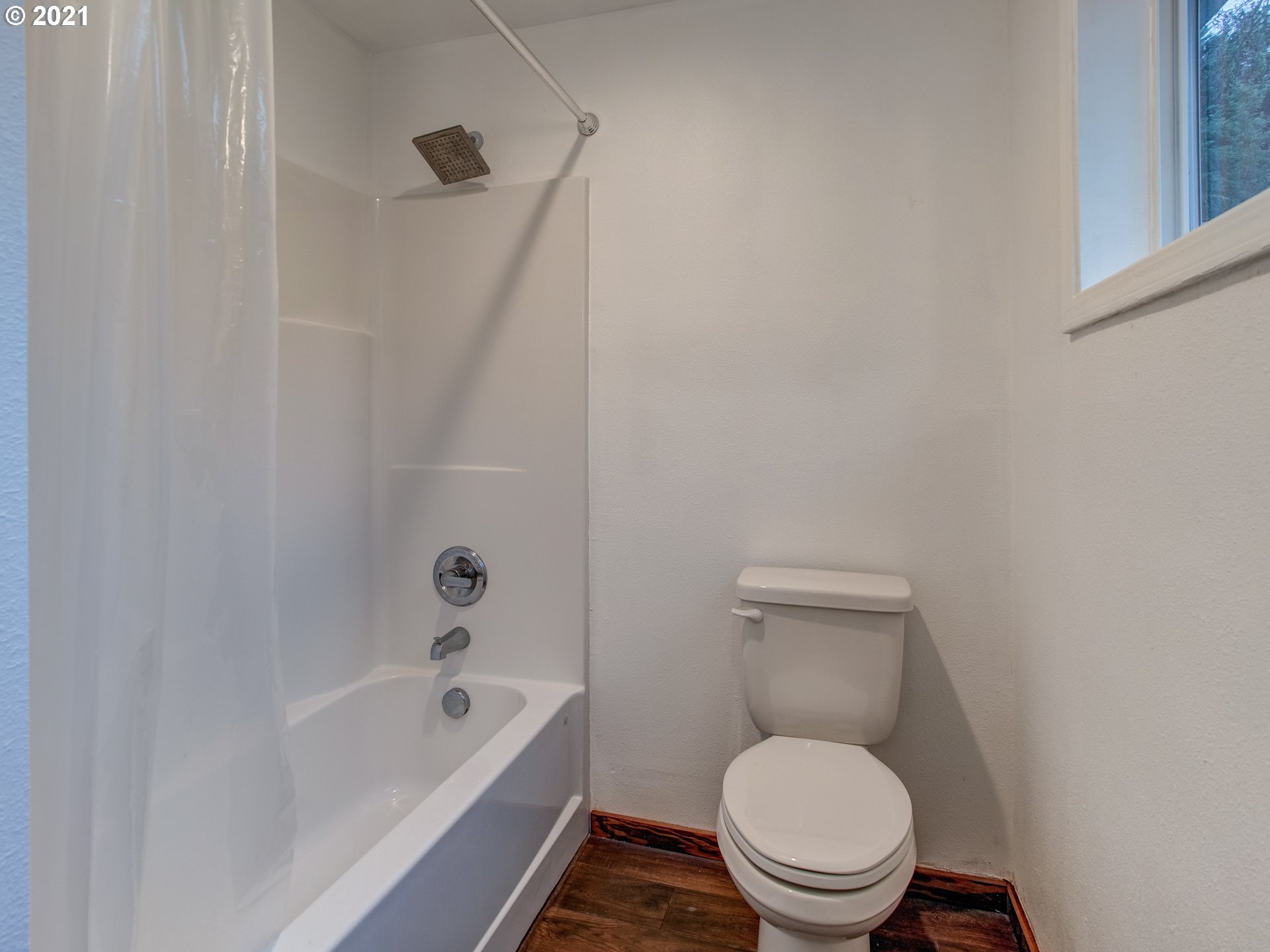 2517 Northeast 199th Street Ridgefield, WA 98642 - Photo 20 of 25 a white toilet sitting next to a bathtub