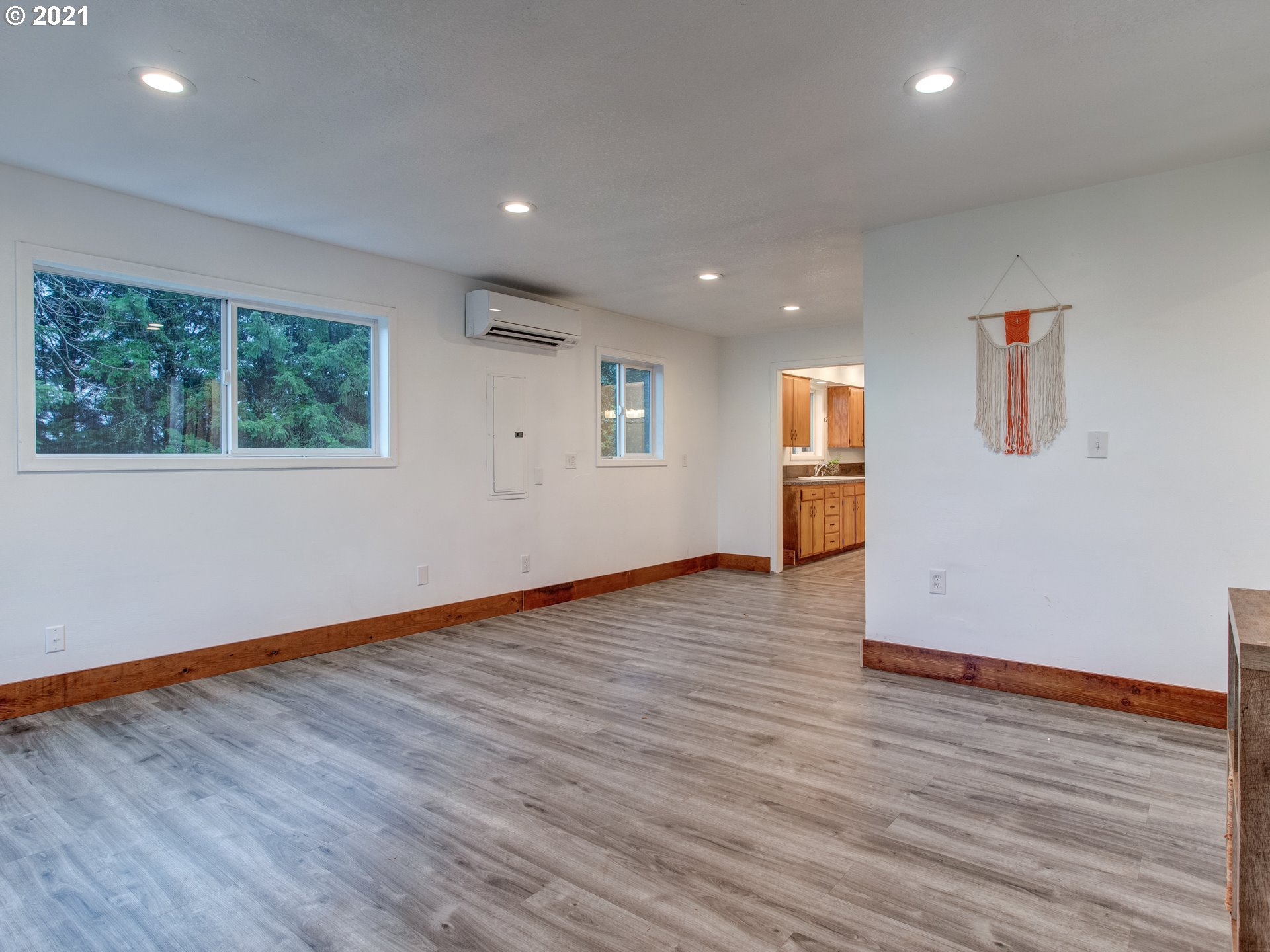 2517 Northeast 199th Street Ridgefield, WA 98642 - Photo 7 of 25 an empty room with wooden floor and windows
