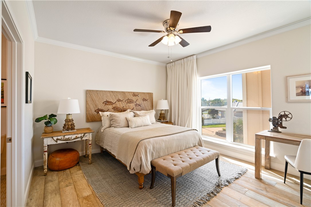 13 Sea Shell Shores Rockport, TX 78382 - Photo 22 of 40 a bedroom with a bed a couch and a window