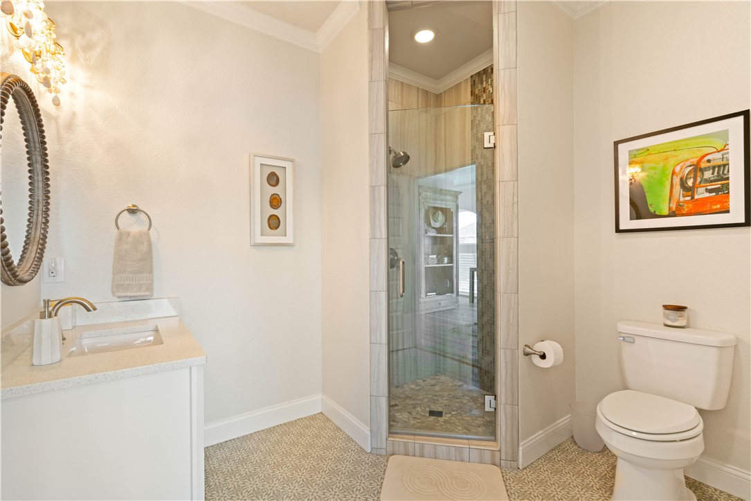 13 Sea Shell Shores Rockport, TX 78382 - Photo 23 of 40 a bathroom with a sink and a mirror