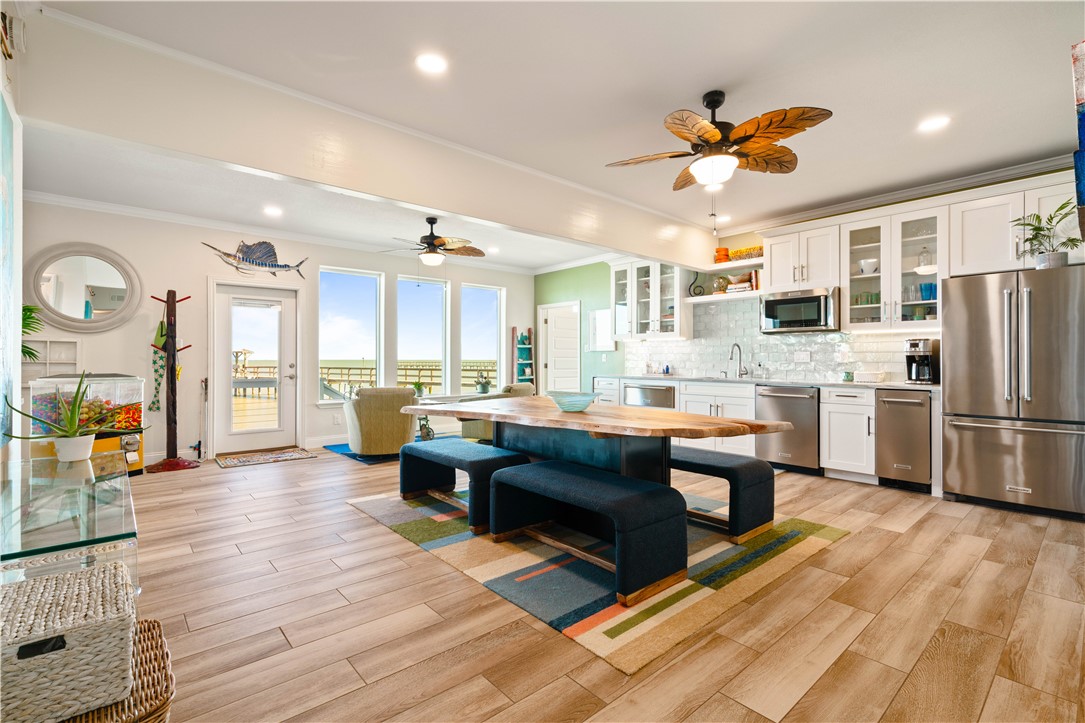 13 Sea Shell Shores Rockport, TX 78382 - Photo 31 of 40 a living room with stainless steel appliances granite countertop furniture wooden floor and a view of kitchen