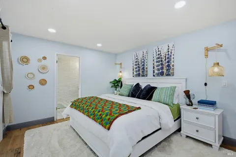 a bedroom with a bed and a dresser