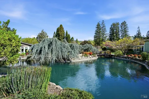 a view of a lake with a house in the background