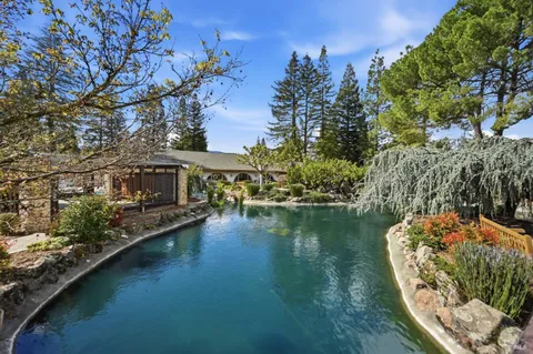 a view of a garden with a building in the background
