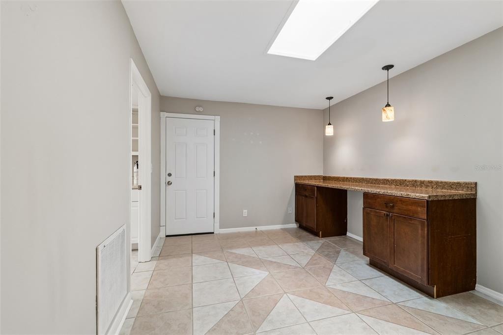 1470 Burnham Lane Dunedin, FL 34698 - Photo 15 of 42 a view of a hallway with cabinets