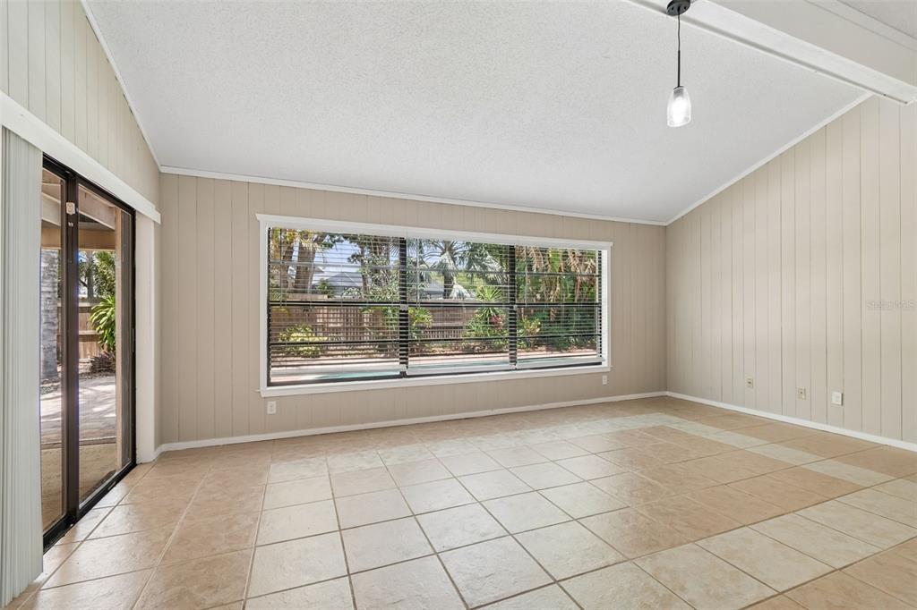 1470 Burnham Lane Dunedin, FL 34698 - Photo 16 of 42 a view of an empty room with a window