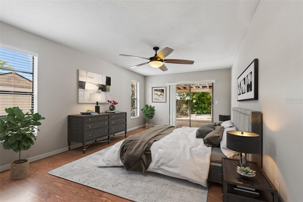 1470 Burnham Lane Dunedin, FL 34698 - Photo 19 of 42 a bedroom with a bed and a potted plant