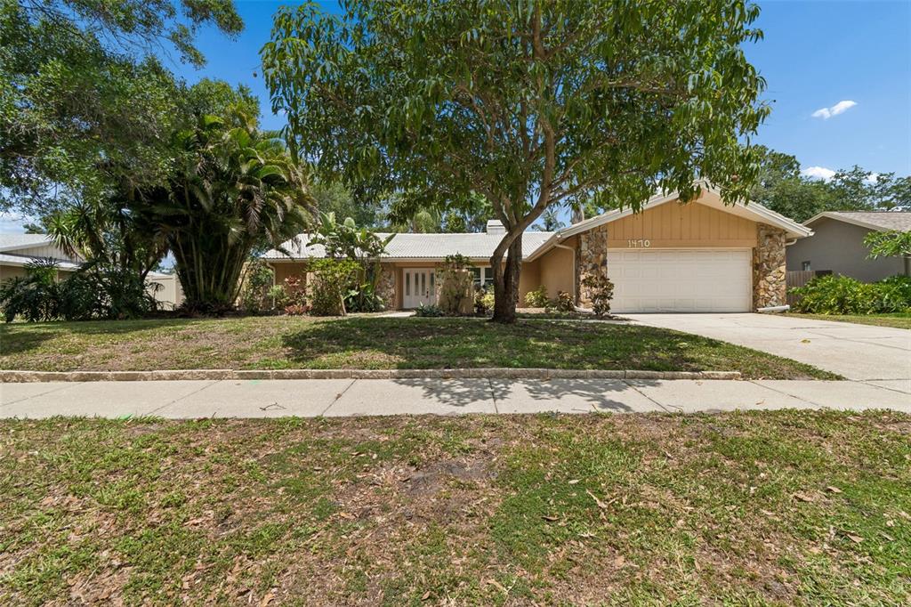 1470 Burnham Lane Dunedin, FL 34698 - Photo 2 of 42 a view of a house with a yard