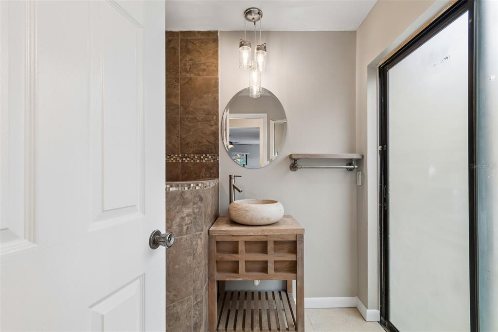1470 Burnham Lane Dunedin, FL 34698 - Photo 25 of 42 a room that has a bed and a dresser in it