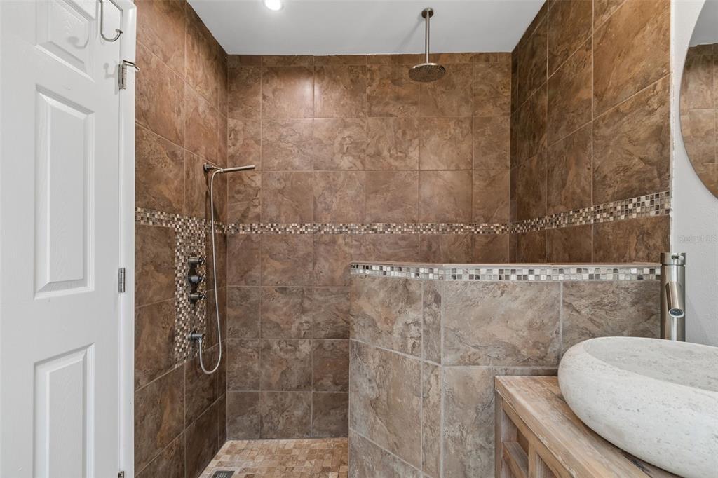 1470 Burnham Lane Dunedin, FL 34698 - Photo 26 of 42 a bathroom with a shower and a toilet