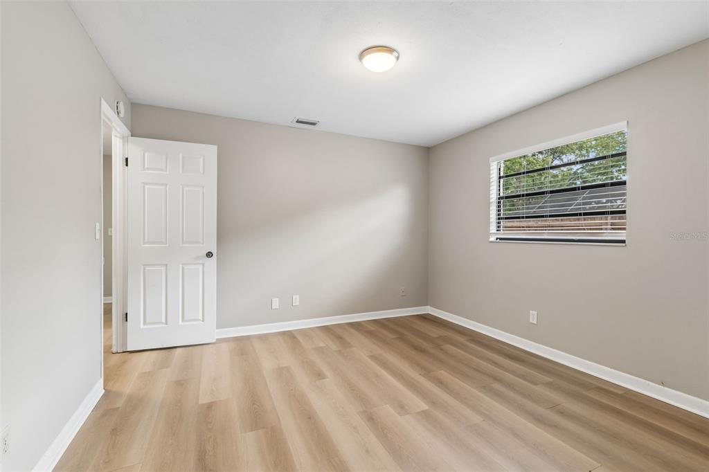 1470 Burnham Lane Dunedin, FL 34698 - Photo 28 of 42 a view of an empty room with a window