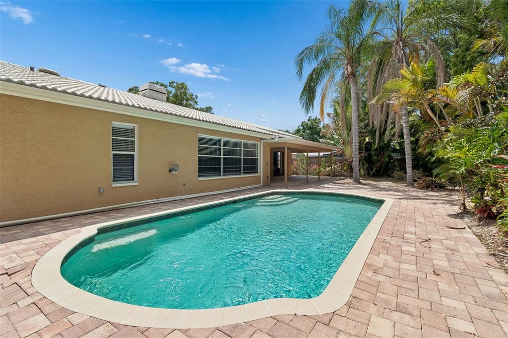 1470 Burnham Lane Dunedin, FL 34698 - Photo 33 of 42 a view of a house with a backyard