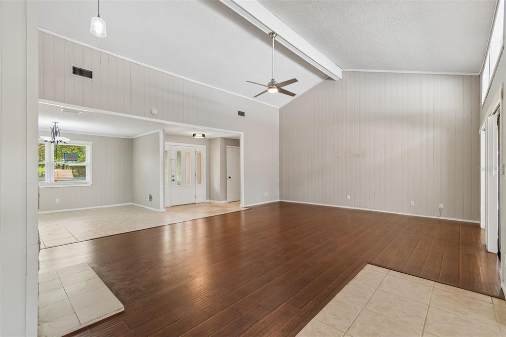 1470 Burnham Lane Dunedin, FL 34698 - Photo 6 of 42 an empty room with wooden floor and windows