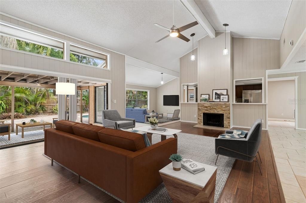 1470 Burnham Lane Dunedin, FL 34698 - Photo 7 of 42 a living room with furniture fireplace and flat screen tv