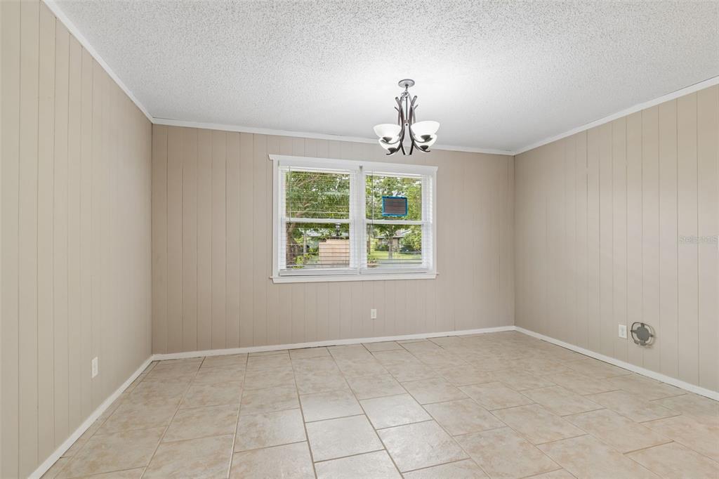 1470 Burnham Lane Dunedin, FL 34698 - Photo 10 of 42 a view of a livingroom with a window