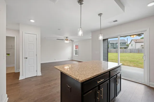 a kitchen with a table and chairs