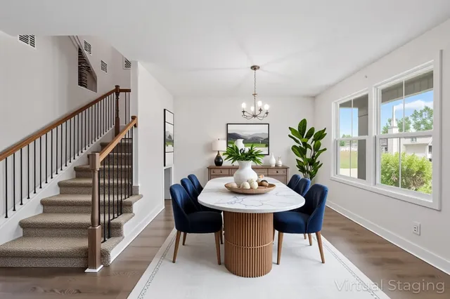 a view of a dining room with furniture window and wooden floor