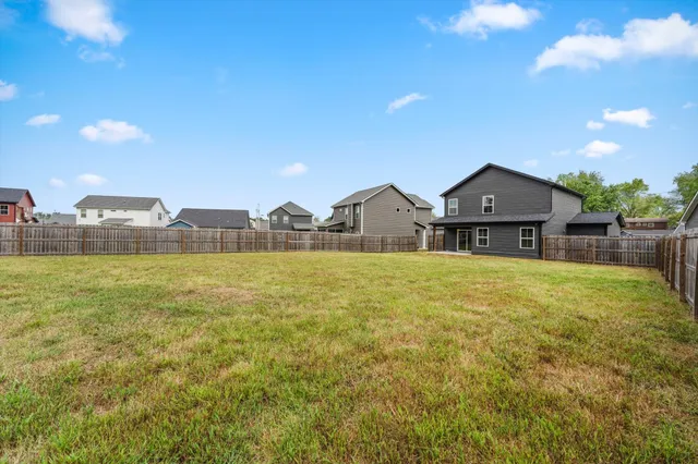 a front view of house with yard and seating area