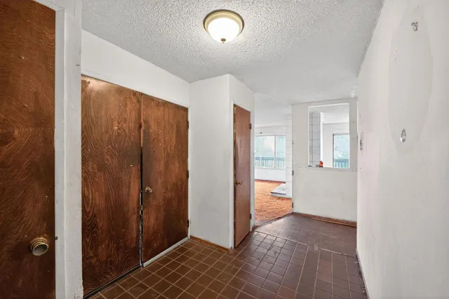 a view of a hallway with bathroom