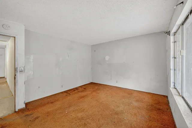 an empty room with a bench