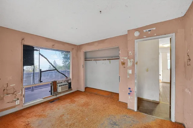a view of livingroom with hardwood floor and cabinet