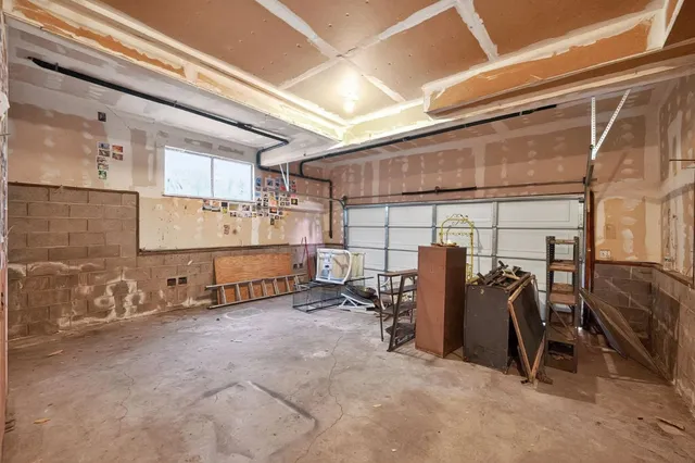 a view of a backyard with wooden fence