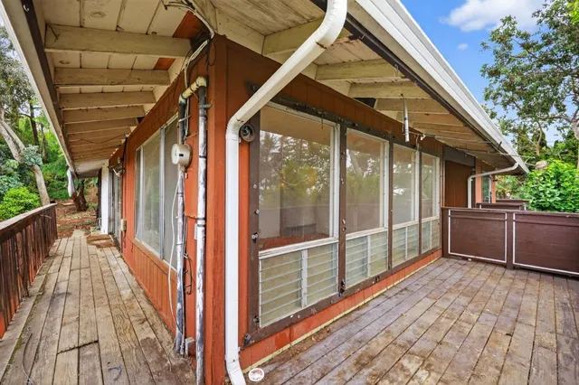 a view of a house with backyard and wooden floor
