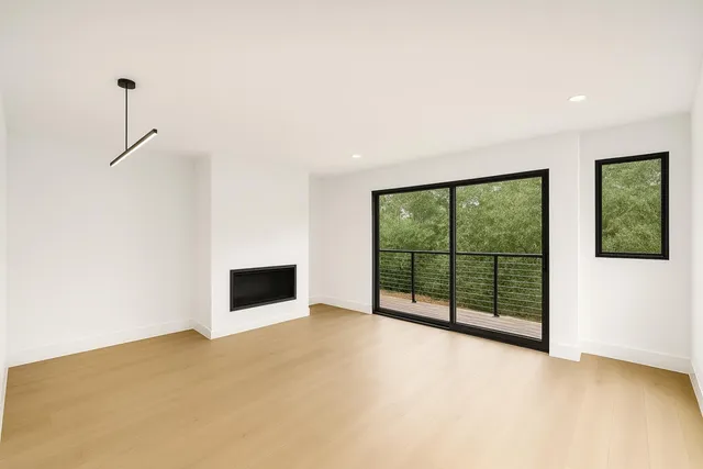 a view of an empty room with windows