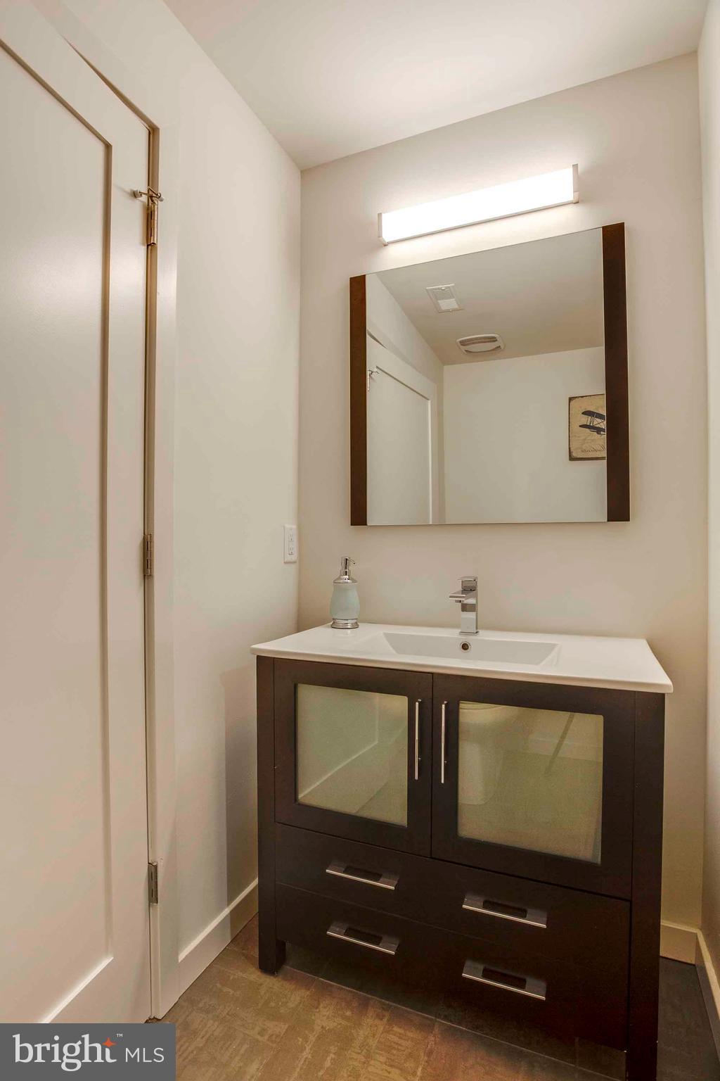 2028-34 Rittenhouse Square, Unit 102 Philadelphia, PA 19103 - Photo 6 of 13 a bathroom with a sink and a mirror