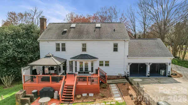 an aerial view of a house with swimming pool