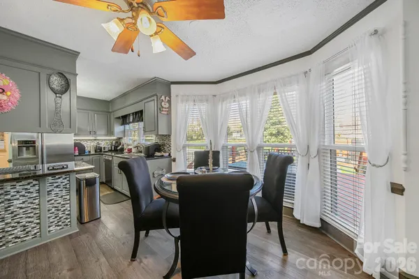 a view of a dining room with furniture and window