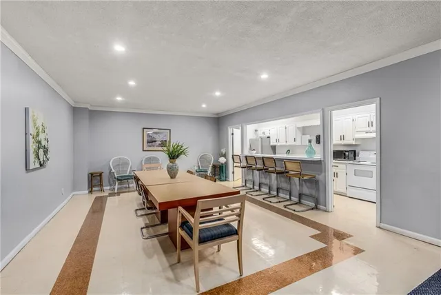 a dining room with a table and chairs