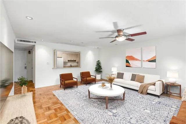 a living room with furniture and a rug