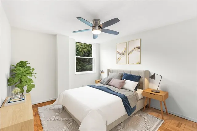 a bedroom with a bed and a window