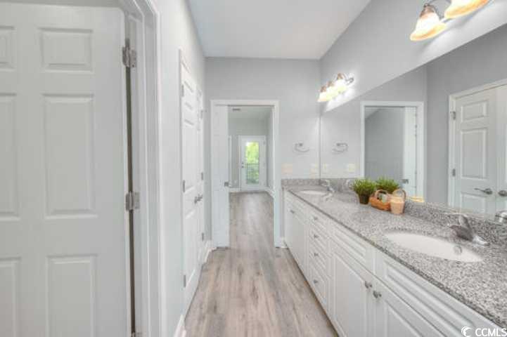 70 Addison Cottage Way, Unit 319 Murrells Inlet, SC 29576 - Photo 15 of 30 Full bathroom featuring double vanity and light wood-style flooring
