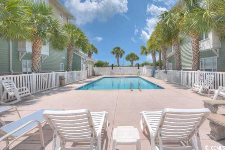 70 Addison Cottage Way, Unit 319 Murrells Inlet, SC 29576 - Photo 28 of 30 Community pool featuring a patio area