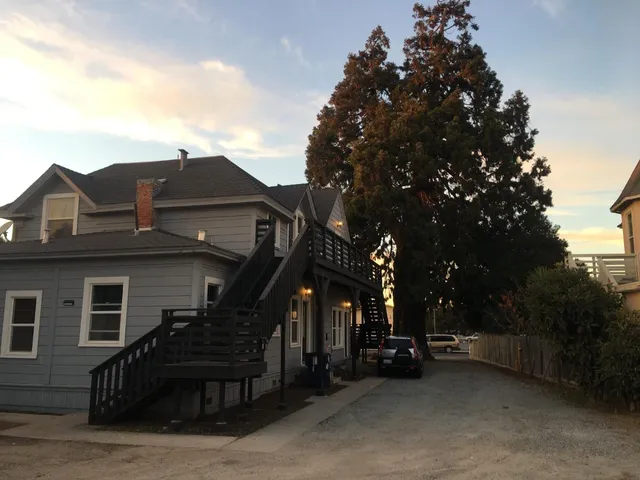 a view of a house with a cars park
