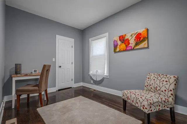 a bathroom with a granite countertop toilet a sink and bathtub