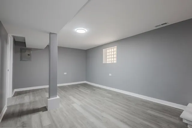 a view of a livingroom with furniture and a lamp