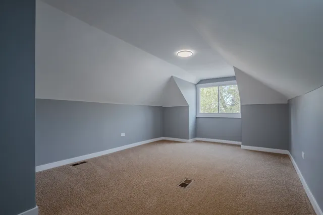 a view of a livingroom with furniture and a ceiling fan