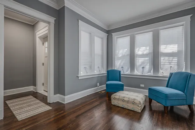a living room with furniture and a rug