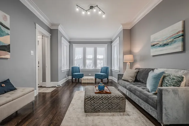 a dining room with wooden floor and a table