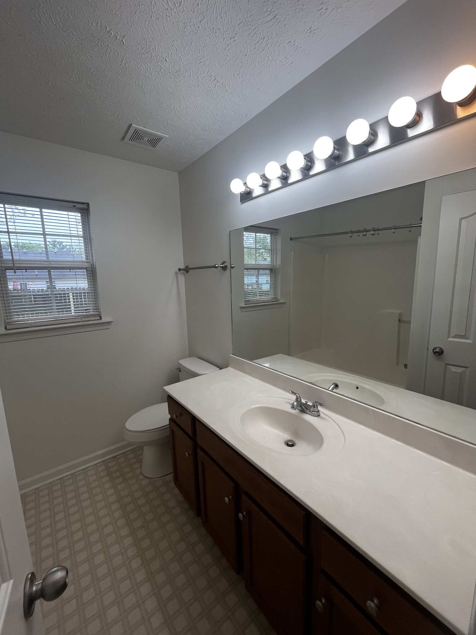1175 Catawba Way Murfreesboro, TN 37130 - Photo 7 of 11 a bathroom with a sink a light fixture and a mirror