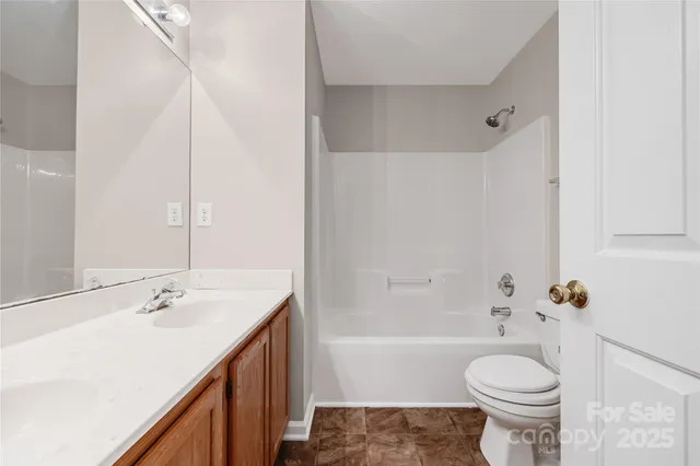 a view of an empty room with closet area