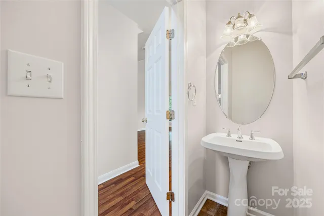 a view of an entryway with wooden floor