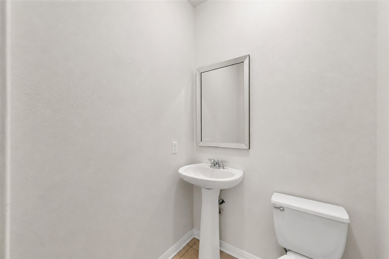 1443 Meadowhigh Lane Spring, TX 77373 - Photo 6 of 23 a bathroom with a sink a toilet and mirror