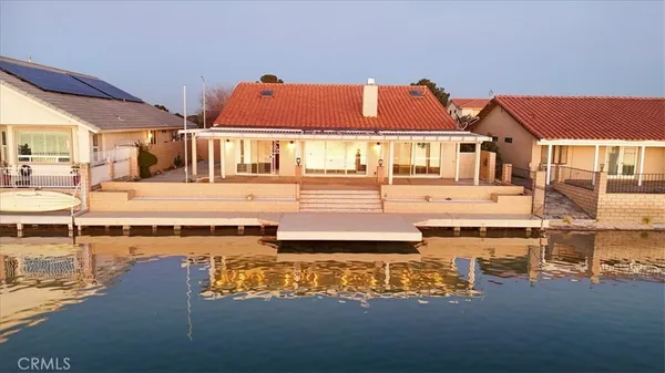 a large white building with a white pool